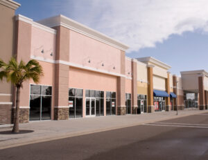 empty commercial spaces on a shopping center strip