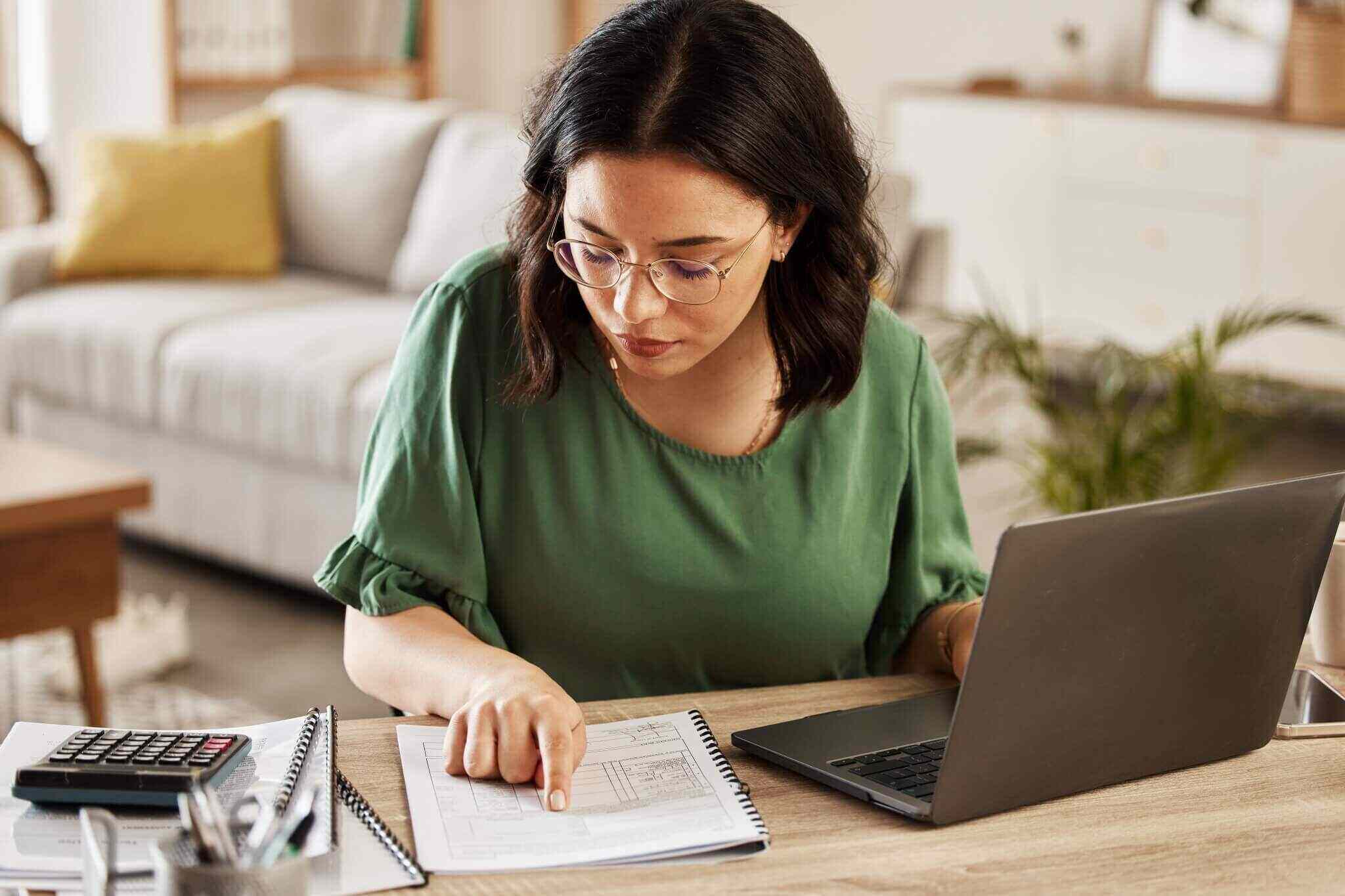 finance and woman with laptop in home office for debt budget