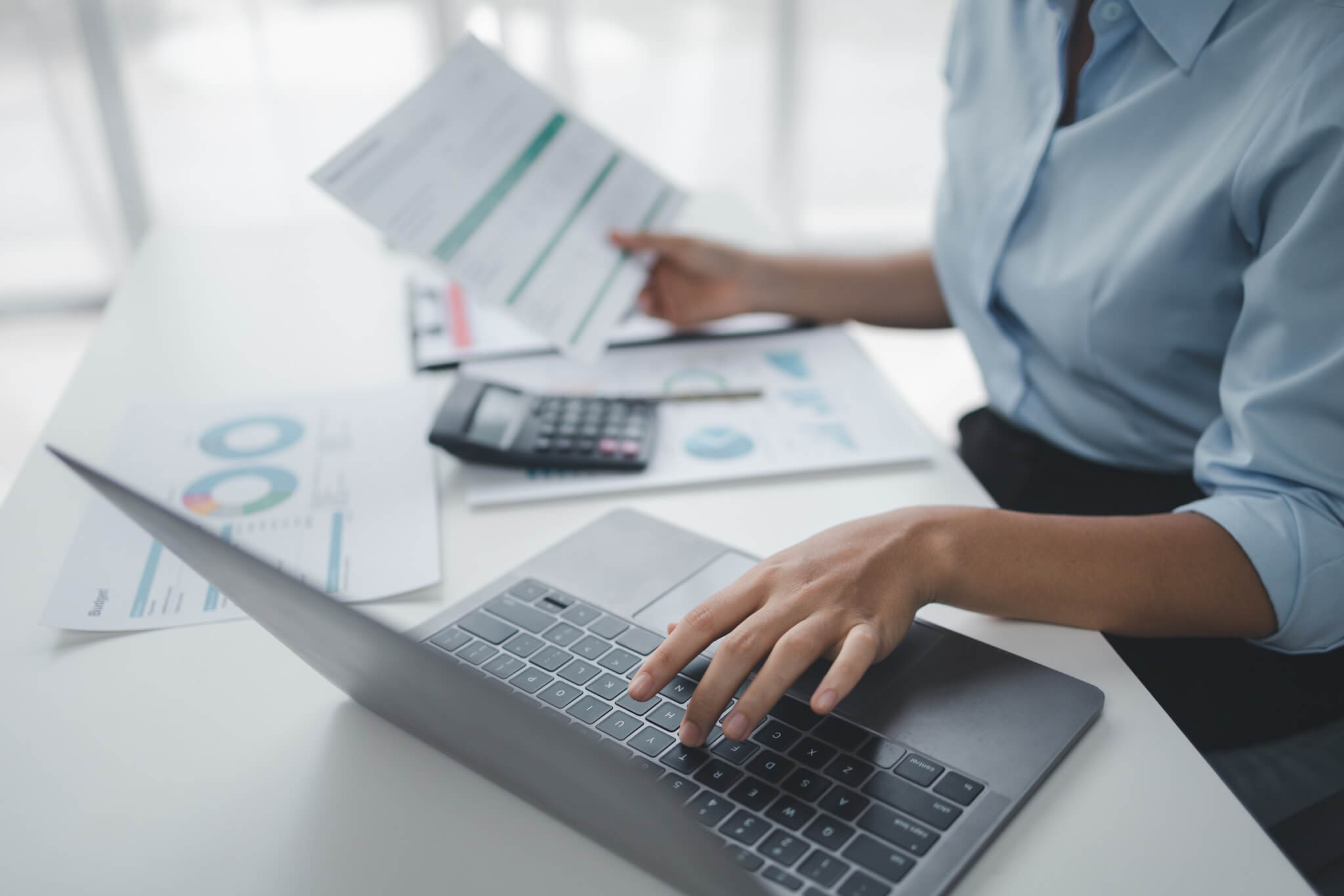 person working with documents on desk