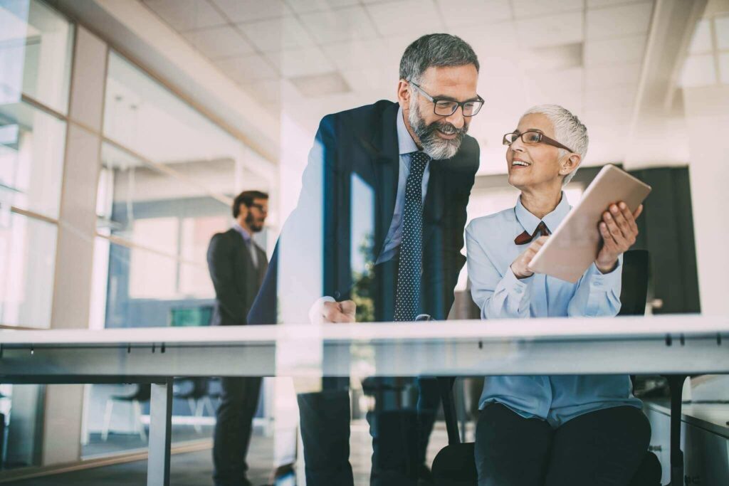 Senior business accountants working together at modern office