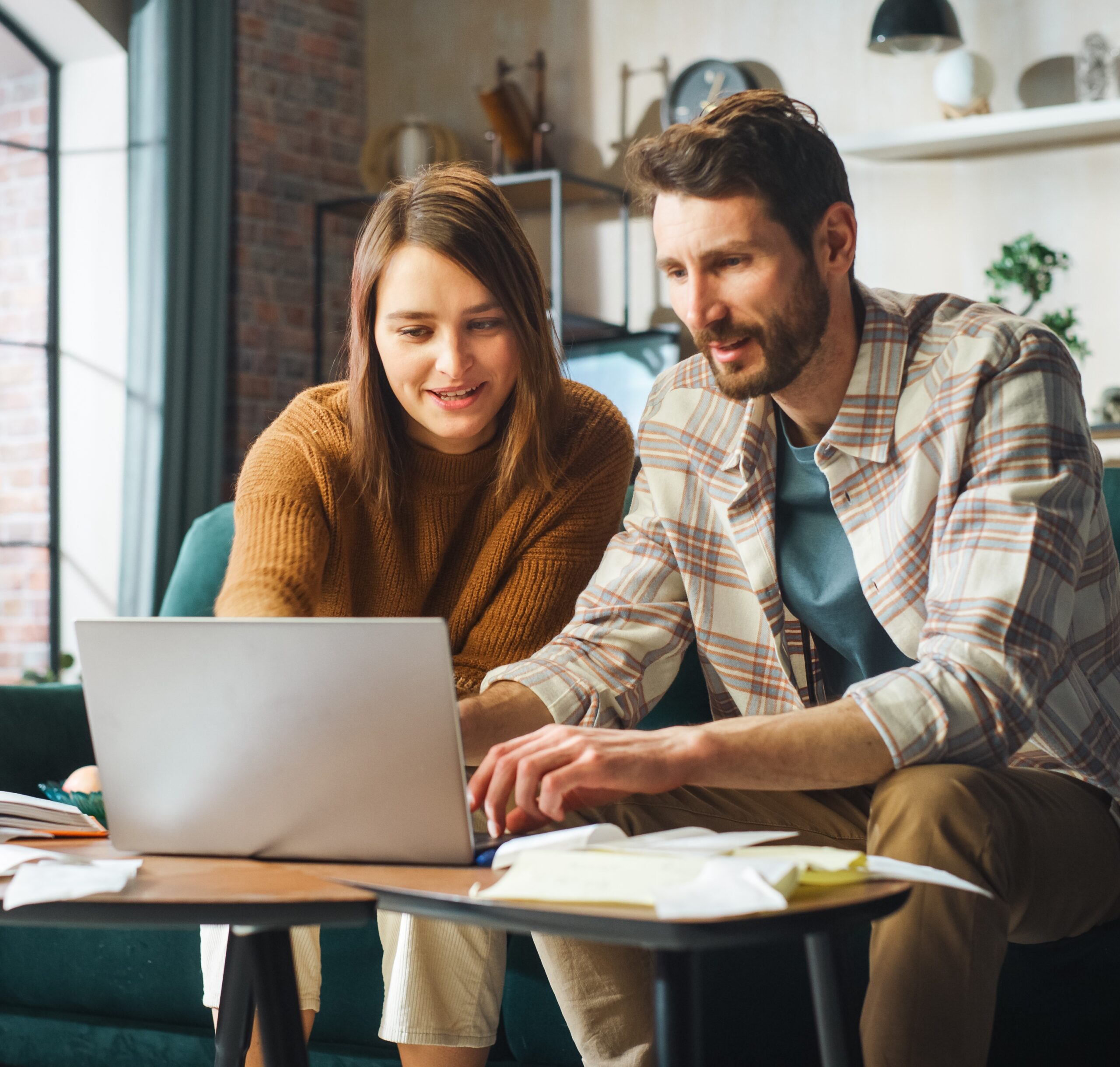 couple applying for HELOC loan on laptop