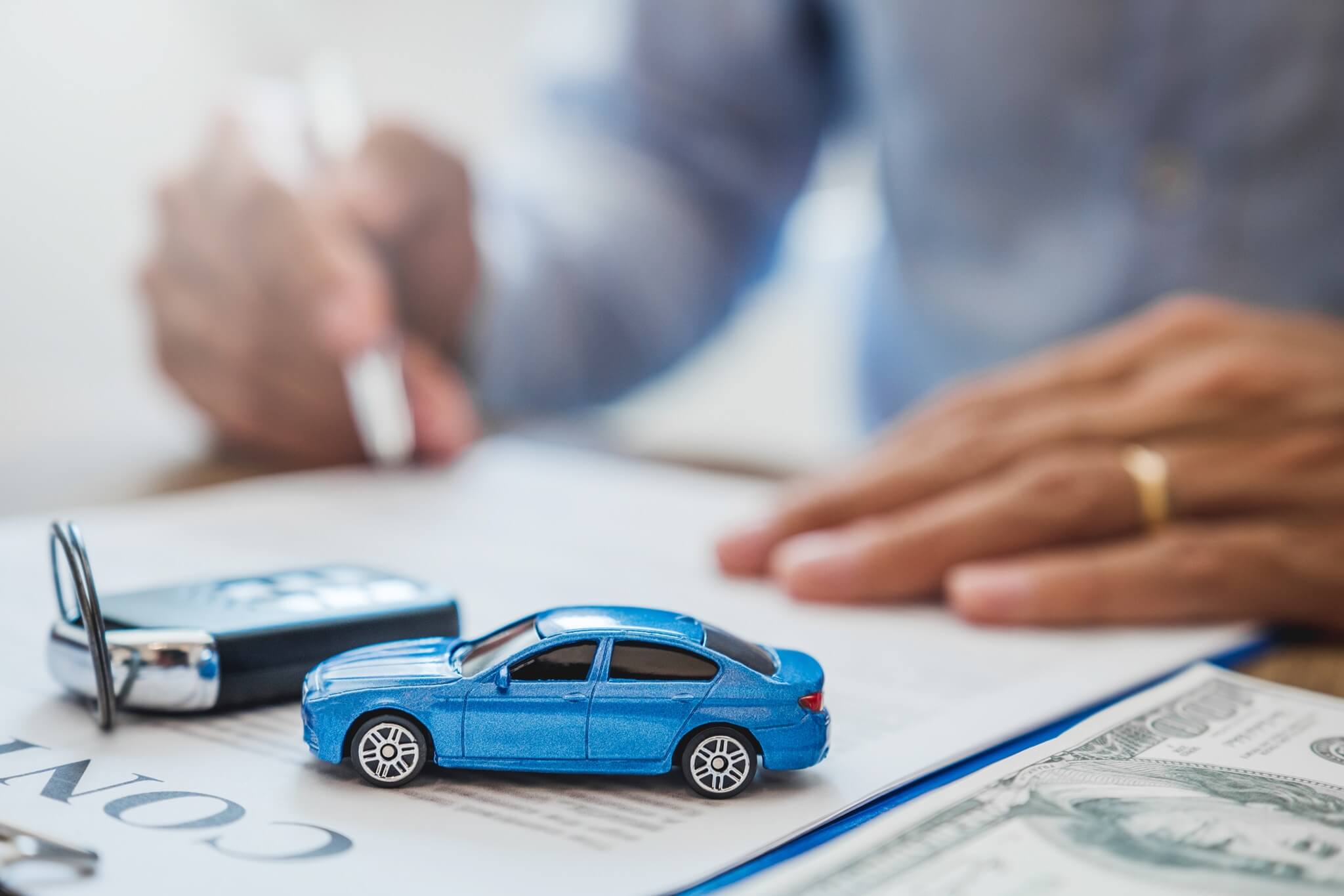 sale agent deal to agreement successful car loan contract with customer and sign agreement contract Insurance car concept