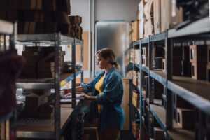 woman back stocking products for a small business