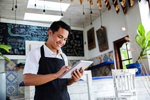 Maryland Cafe Business Owner checking payroll