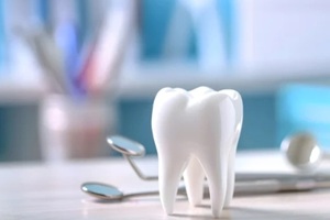 dental practice management consultants concept with tooth model and tools