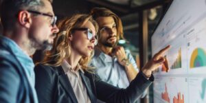 Executives discussing finances and considering their options before creating an exit strategy