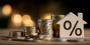 home loan idea with a wooden house, percent sign symbol to represent maryland mortgage rates